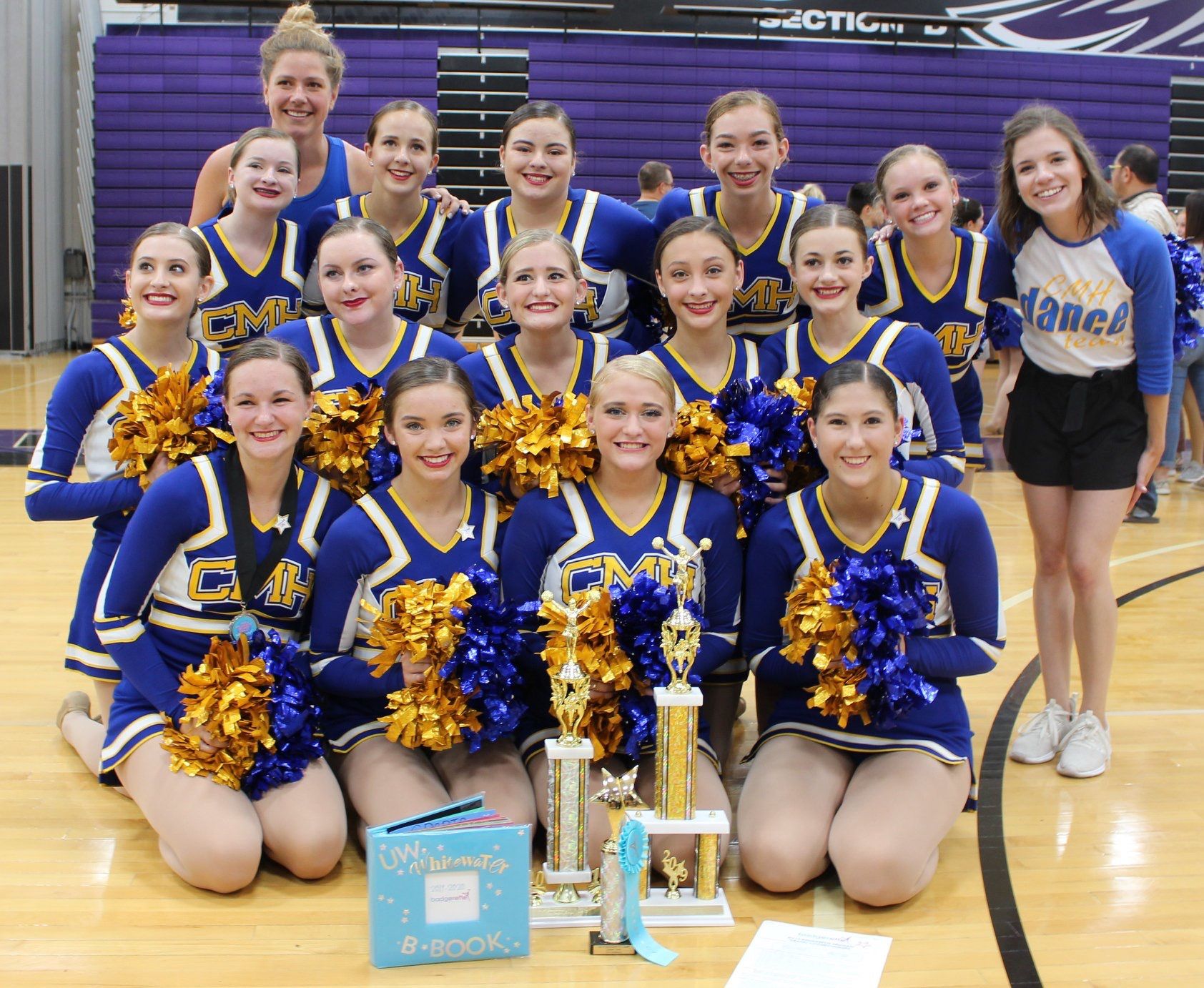 Junior Crusader Poms team poses with trophy
