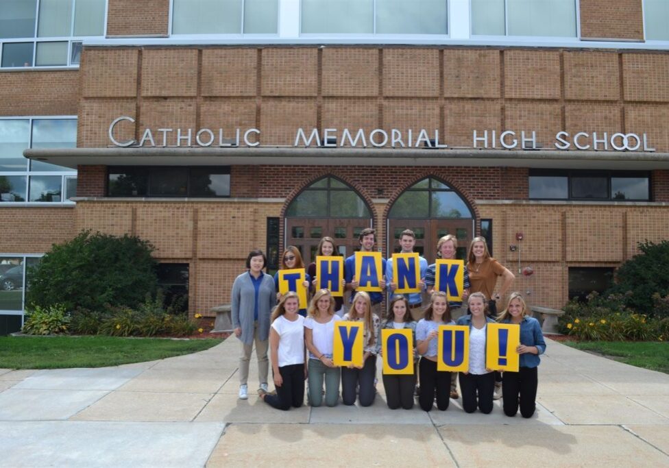 CMH Students stand in front of school with thank you sign